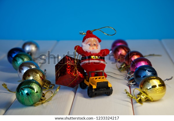 Toy Santa\
on a magic car carries gifts for the kids. Happy New Year and Merry\
Christmas! 2019                       \
