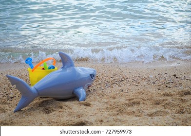 Toy Shark Left Behind On The Beach By Kids