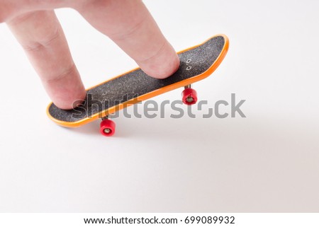 Toy skateboard on a light background