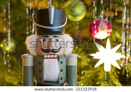 toy soldier wooden nutcracker statue standing in front of decorated christmas tree - Wooden Toy Soldiers Christmas Decorations toy soldier wooden nutcracker statue standing in front of decorated christmas tree - Wooden Toy Soldiers Christmas Decorations