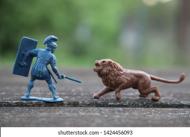 Toy soldiers, gladiators and lion. Roman legionary is fighting against lion. Retro vintage.  Soviet Union toys, plastic figures