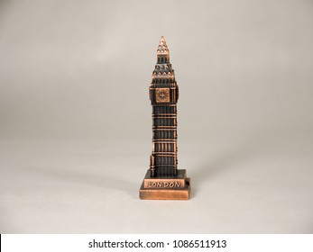 A Toy Souvenir Of Big Ben Sitting On A White Backdrop.