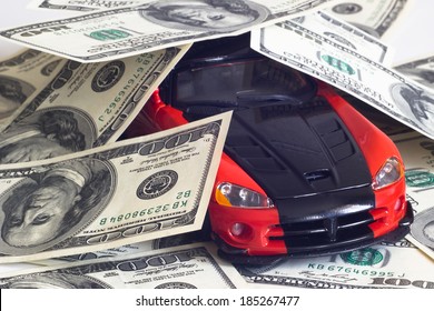 Toy Sports Car On A Background Of Money