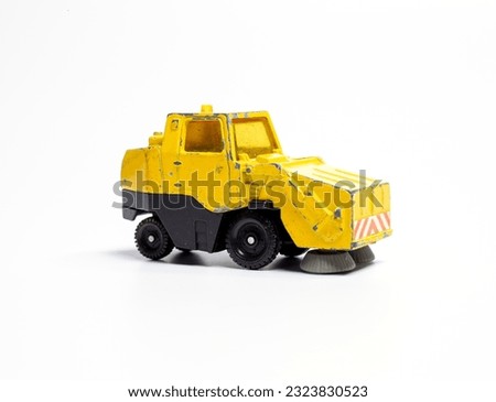A toy street cleaning car