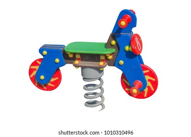 Toy swing motorcycle on the big metal spring on the white background. Isolated