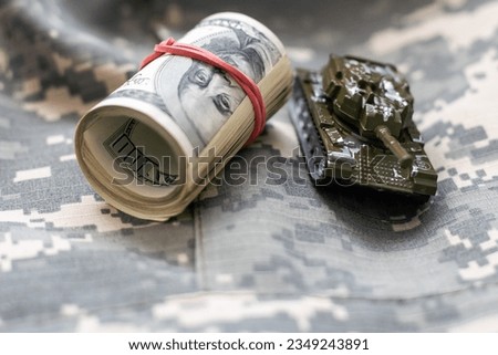 a toy tank, dollars, business