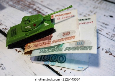 toy tank on the russian banknote 5000 and 1000 roubles crisis wallpaper - Shutterstock ID 2126445584