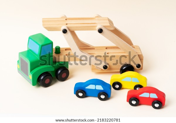 Toy tow truck\
towing damaged cars after a serious accident. Car traffic, car\
crash, dangerous incident.