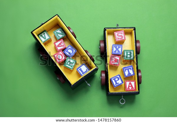 Toy Train\
with Alphabet Cubes on Green\
Background