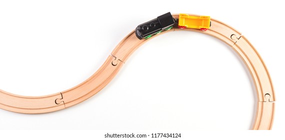 Toy Train With Curved Wooden Railways On White Background. Top View.