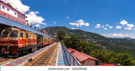 Toy Train Kalka-Shimla Route, Standing On Shimla Railway Station With City In Background. Shimla Is State Capital & Tourist Holiday Destintation In The Hill State Himachal Pradesh, India.