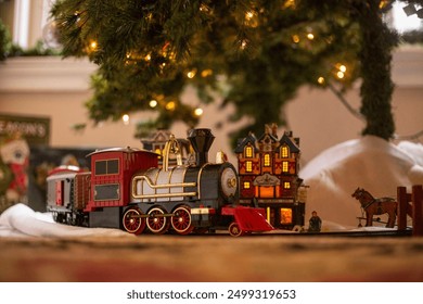 Toy Train Under Christmas Tree - Powered by Shutterstock