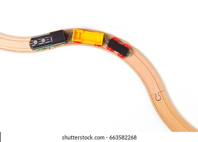 Toy Train And Wooden Rails On White Background. Top View.