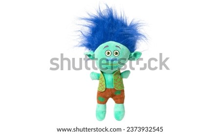 Toy troll with blue hair isolated on white background. High quality photo