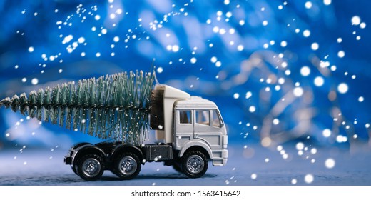 Toy truck carries Christmas tree - Powered by Shutterstock