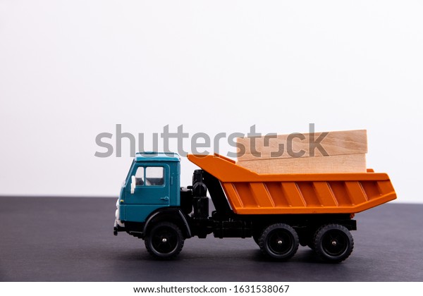 Toy truck\
carrying boxes with cargo in the\
back
