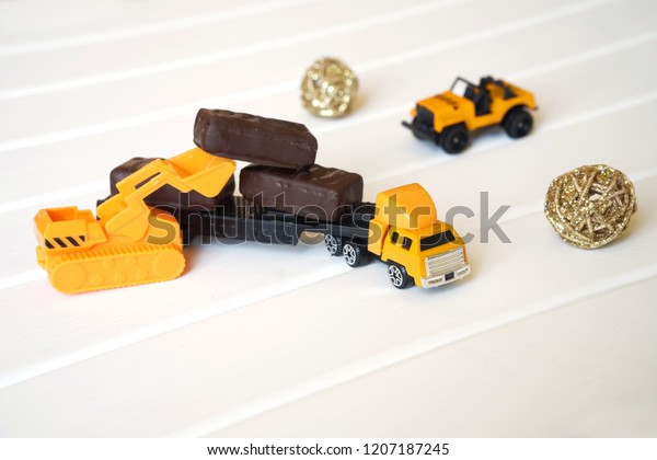 A\
toy truck is loaded with candy to take to the children for a\
holiday. Preparation for the holiday.              \
