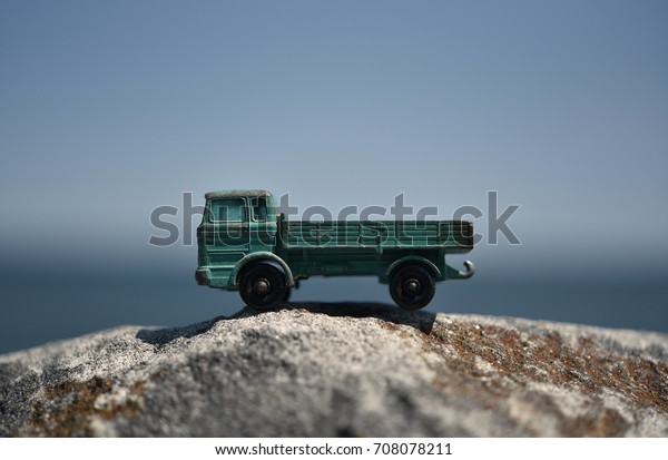 Toy Truck on Rocks by the\
Ocean