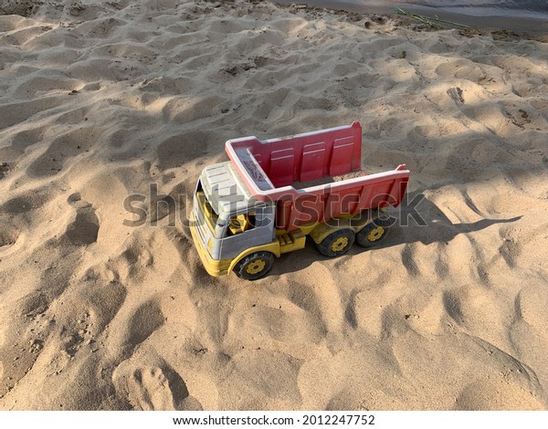 Toy truck on the sand,\
vintage truck