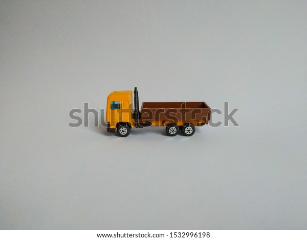 Toy truck on a\
white background side view