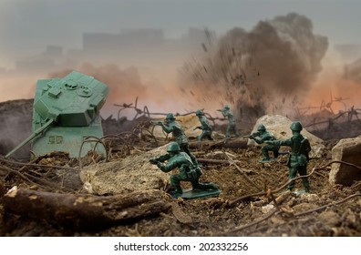 Toy war field. Plastic toy attack war scene with soldiers, weapons and explosions.
