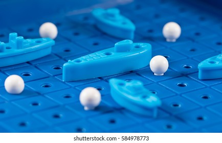 Toy War Ships And Submarine Are Placed On The Playing Board In The Game Battleship