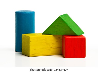 toy wooden blocks, multicolor building construction bricks over white background 