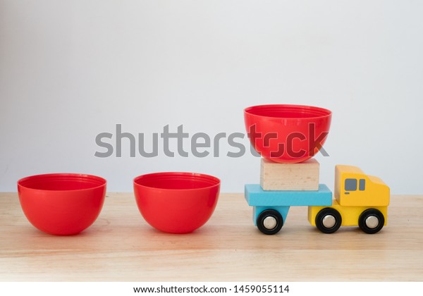 Toy wooden truck carry egg surprise after open.\
Concept of surprise toy for\
fun