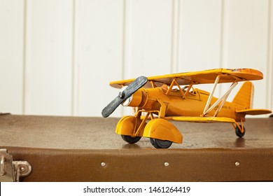 Toy Yellow Metal Plane Old Retro Suitcases White Wooden Background Vintage Tinting Copy Space