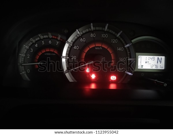 Toyota Dashboard Warning Lights. warning for\
door open, seat belt and hand brake is\
on