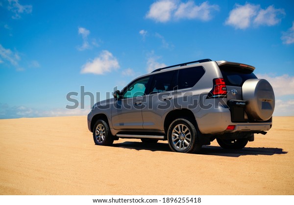 Toyota Land Cruiser Prado standing\
in the middle of the desert 17.01.2021. Walvis Bay, Namibia\
