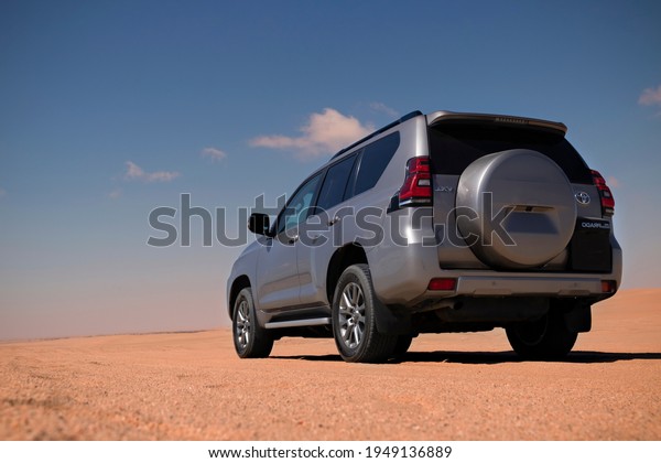 Toyota Land Cruiser Prado standing\
in the middle of the desert 04.04.2021. Walvis Bay, Namibia\
