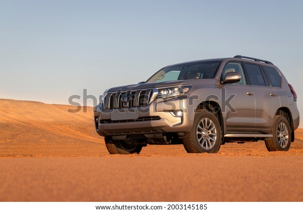 Toyota Land Cruiser Prado standing\
in the middle of the desert 06.07.2021. Walvis Bay, Namibia\

