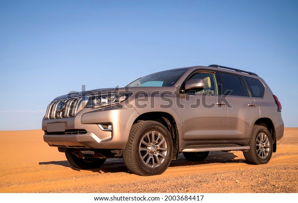 Toyota Land Cruiser Prado\
standing in the middle of the desert 07.07.2021. Walvis Bay,\
Namibia. Africa 