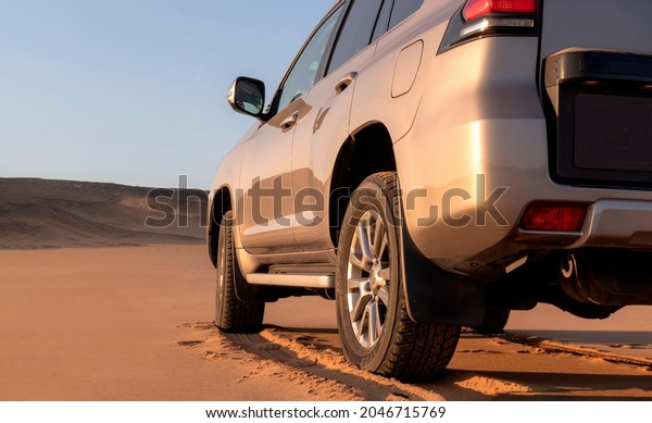 Toyota Land Cruiser Prado standing\
in the middle of the desert  24.09.2021. Namibia\
