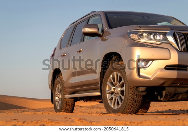 Toyota Land Cruiser Prado\
standing in the middle of the desert 01.10.2021. Walvis Bay,\
Namibia. Africa 