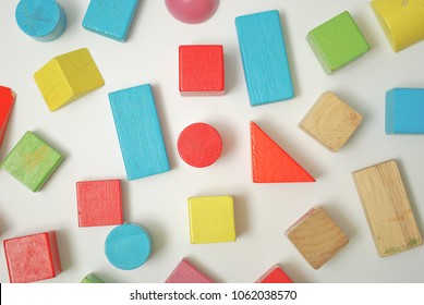 Toys Blocks, Multicolor Wooden Bricks, Children Colorful Building Game Pieces Of Kids Organize Toy. Flat Lay And Isolated White Background