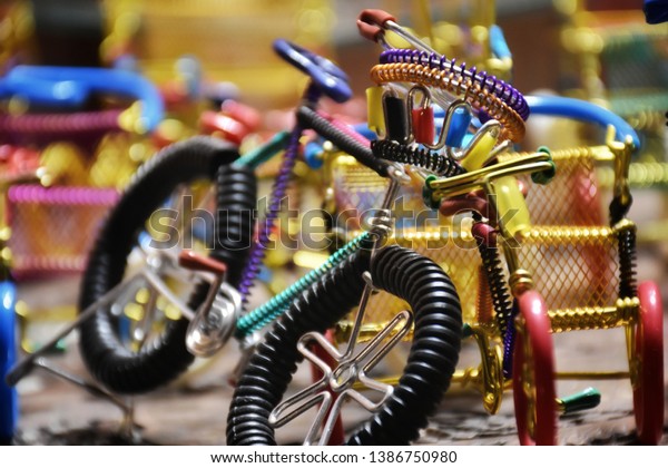 Toys or gift items, cars, cycles, autos, cranes,\
rickshaws etc are being sold in traditional look at a souvenir\
gifts shop in New Delhi India. Best toys for the children.\
Beautiful gift items for\
kids