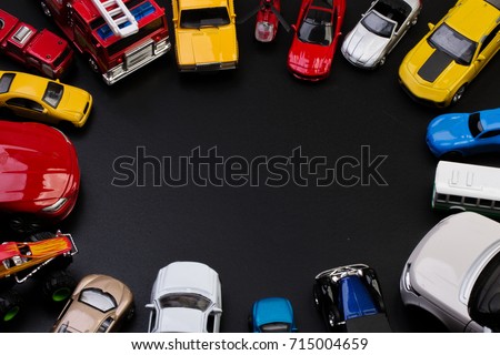 Toys model cars view from above on a black background