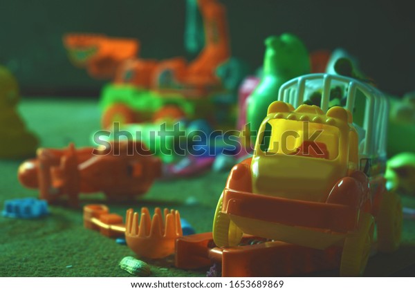 Toys one the ground\
scattered around