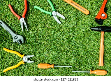 Toys, Repair Tools, Fasteners, Screwdriver Set And Bright Plastic Claw On Artificial Grass