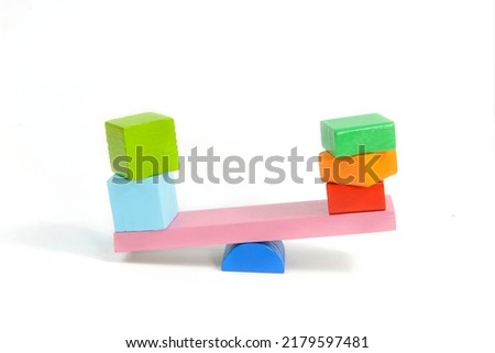 toys seesaw wooden blocks, teeter totter on white background weight cube, swing with heavy and light idea
