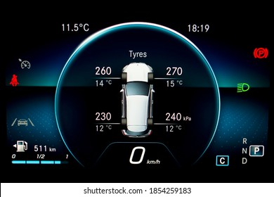 TPMS (Tyre Pressure Monitoring System) With Temperature Measurement Monitoring Display On Car Dashboard Panel. Checking Tires Pressures And Temperature. Car Cluster With Speedometer And Fuel Gauge.