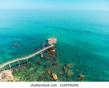 Trabocchi Coast In Italy. Wooden House And Pier On The Beautiful Crystal Clear Blue Water Of The Adriatic Sea