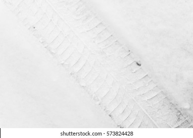 Trace Of Car Tire In The Fresh Snow. Close Up View From Above