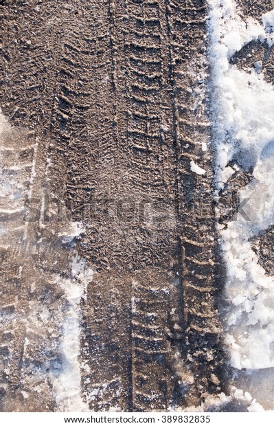 trace of cars on the\
dirt on the nature