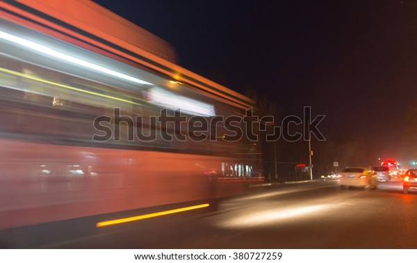 the trace of a moving bus\
at night
