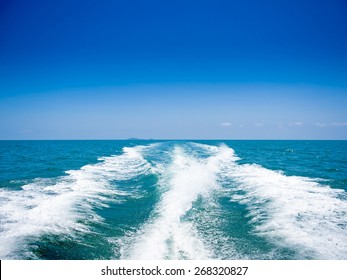 trace tails of speed boat on water surface in the sea