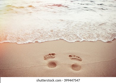 traces of feet on the sand