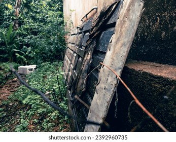 The traces of an old worn door create a picture of nostalgia and the passage of time.  The damage and faded color on the door may give a sense of the history and experiences